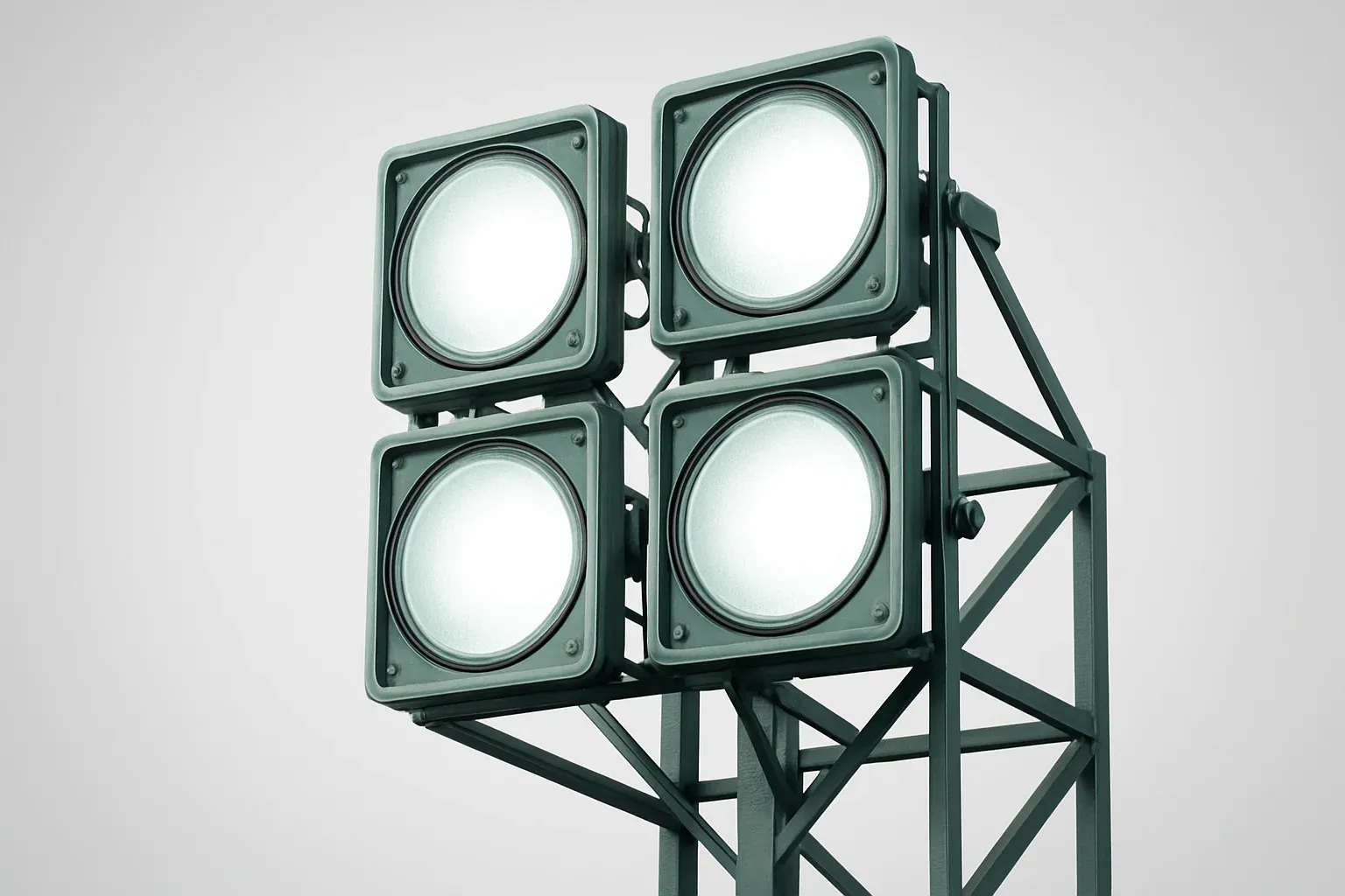 Four bright stadium floodlights viewed through metal structure at dusk
